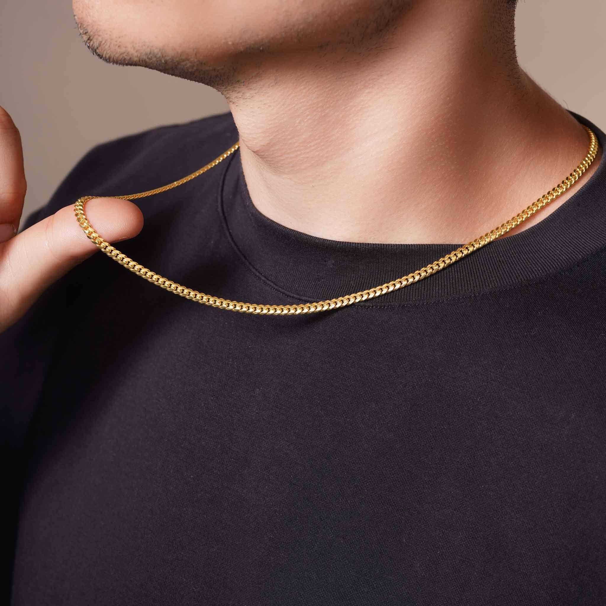 Men's Vermeil Miami Cuban Chain worn elegantly around the neck, showcasing its luxurious 18k gold vermeil shine.