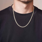 Men's Silver Miami Cuban Chain worn by a man, showcasing its sleek design and durability.