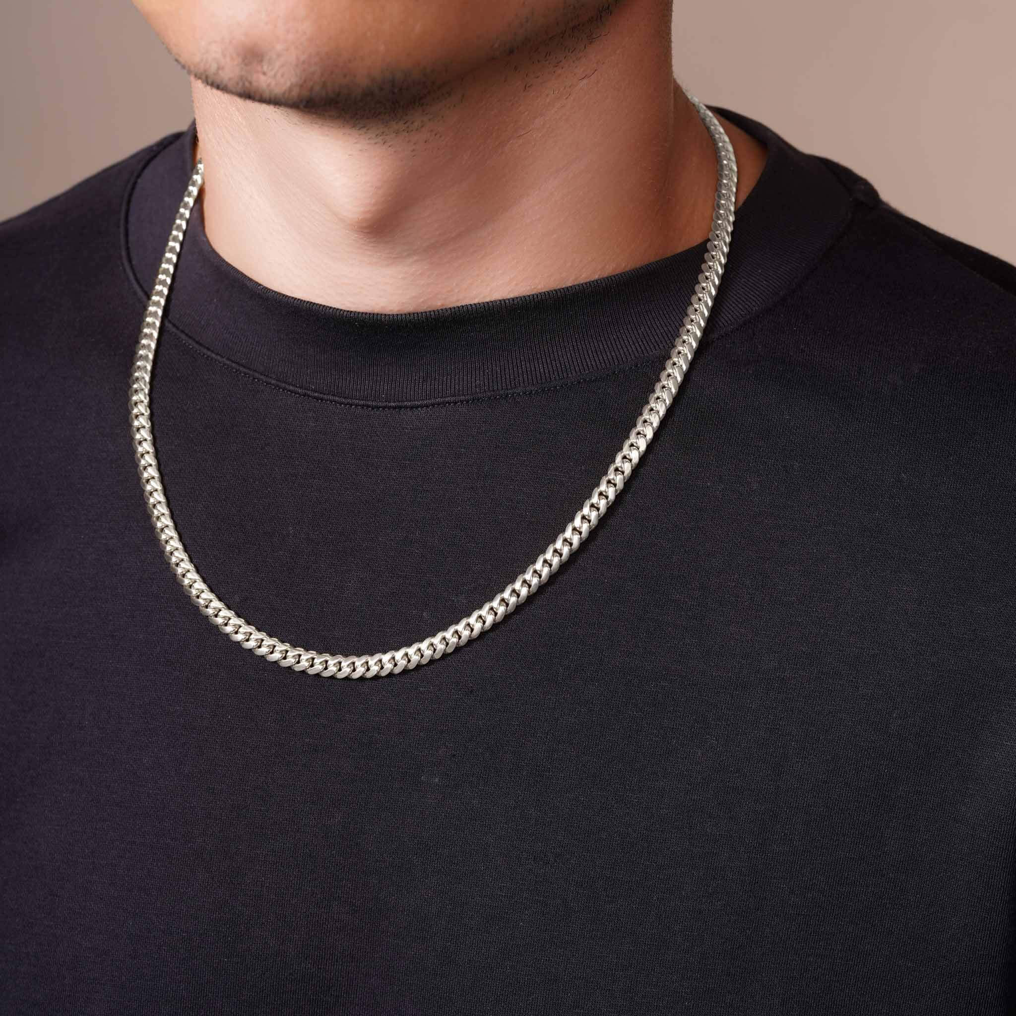 Men's Silver Miami Cuban Chain worn on a model, showcasing its sleek design and polished finish.
