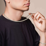Men's Silver Miami Cuban Chain worn by a man, showcasing its sleek design and polished silver finish.
