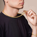 Men's Vermeil Miami Cuban Chain worn by a man showcasing its elegance and luxury.