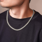 Men's Silver Miami Cuban Chain worn by a model, showcasing its sleek design and polished finish.