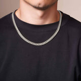 Men's Silver Miami Cuban Chain worn by a man, showcasing its sleek silver finish and classic design.