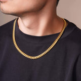 Men's Vermeil Miami Cuban Chain showcased on a model wearing a black shirt, highlighting its luxurious design.