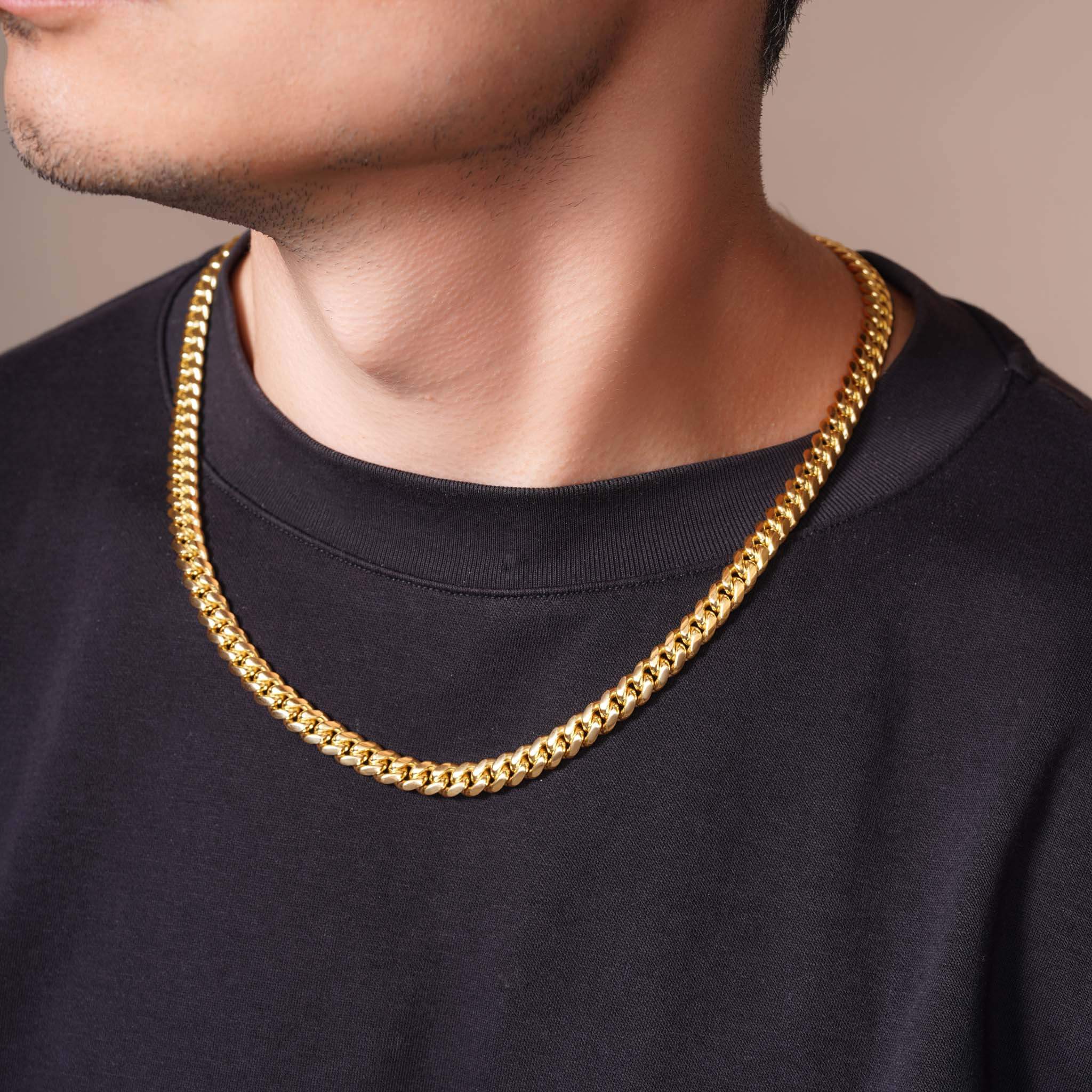 Men's Vermeil Miami Cuban Chain showcased on a model wearing a black shirt, highlighting its luxurious design.