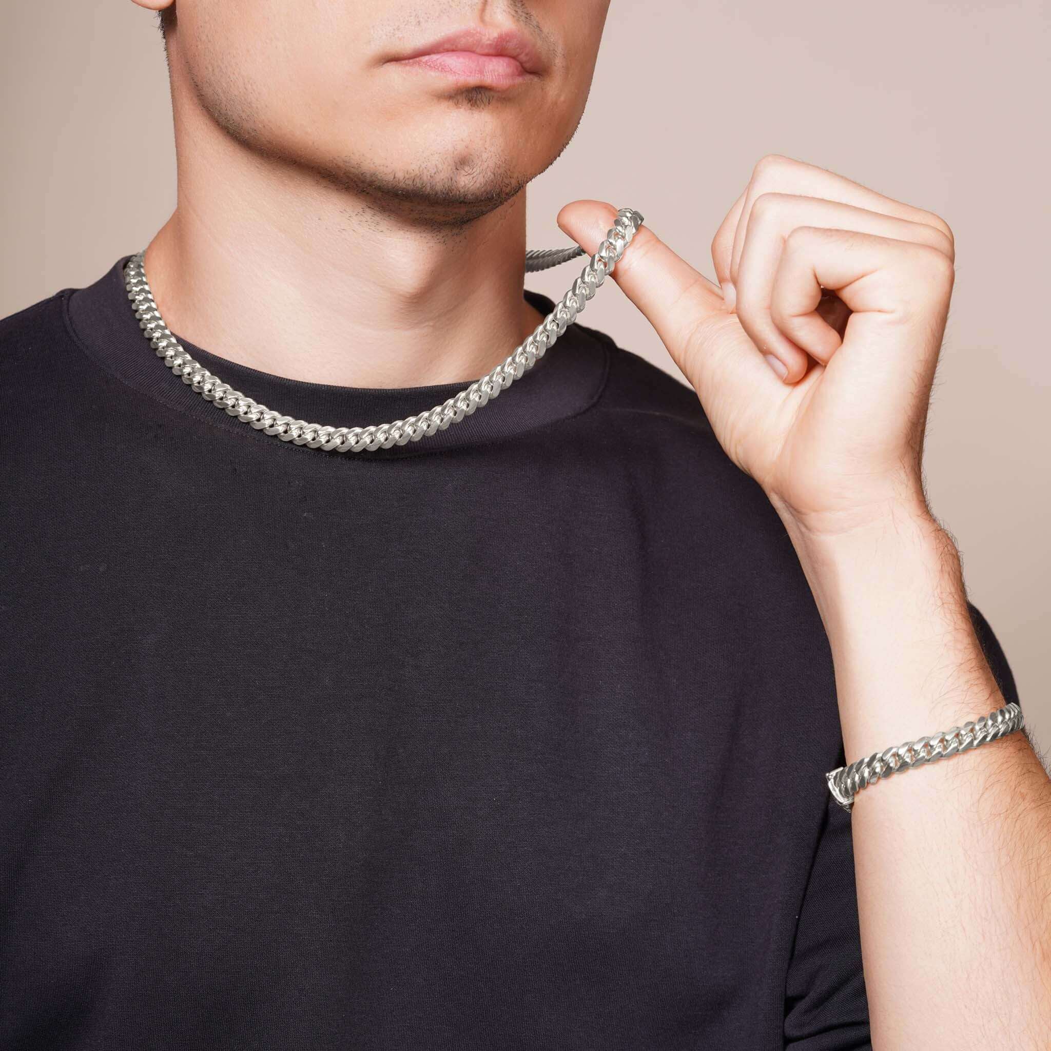 Men's Silver Miami Cuban Chain worn by a model, showcasing its sleek design and polished finish.