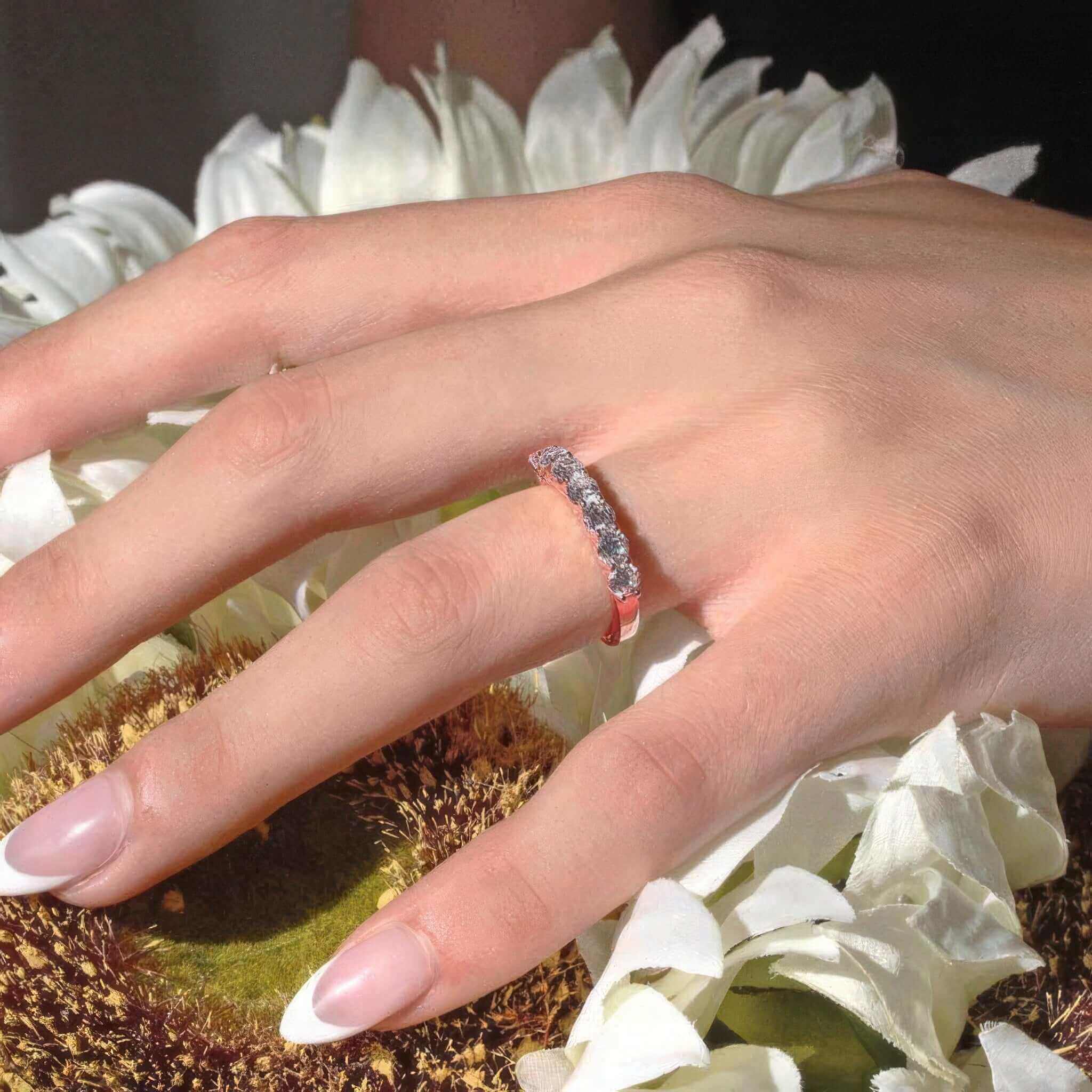 14K Rose Gold Half Eternity Ring worn on a hand.