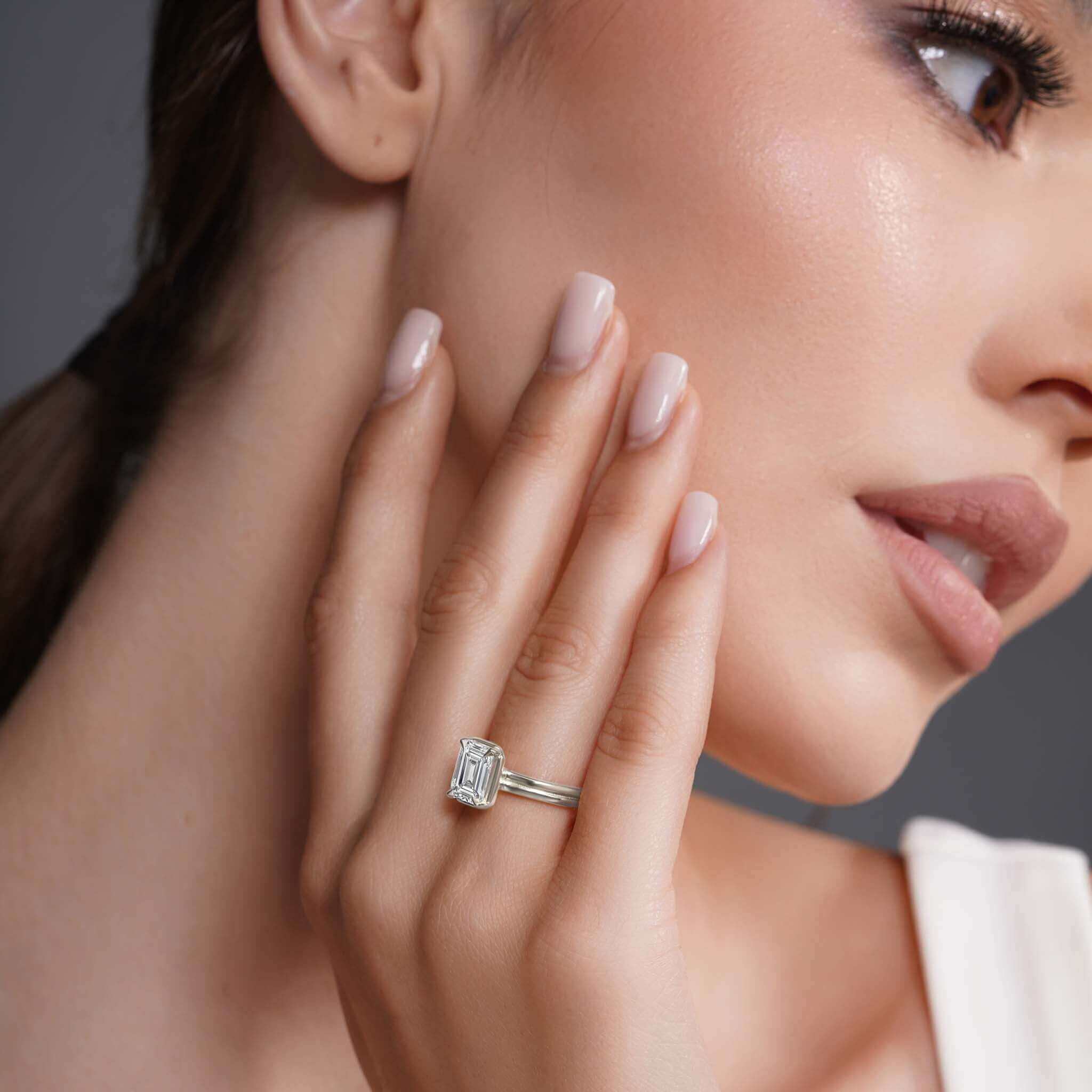 Finger Rings and Meaning: What Each Finger Really Says About You - close-up of a woman wearing a diamond ring on her finger.