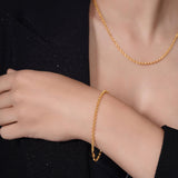 Vermeil Gold Rolo Bracelet worn on a model's wrist, showcasing its elegance and craftsmanship.