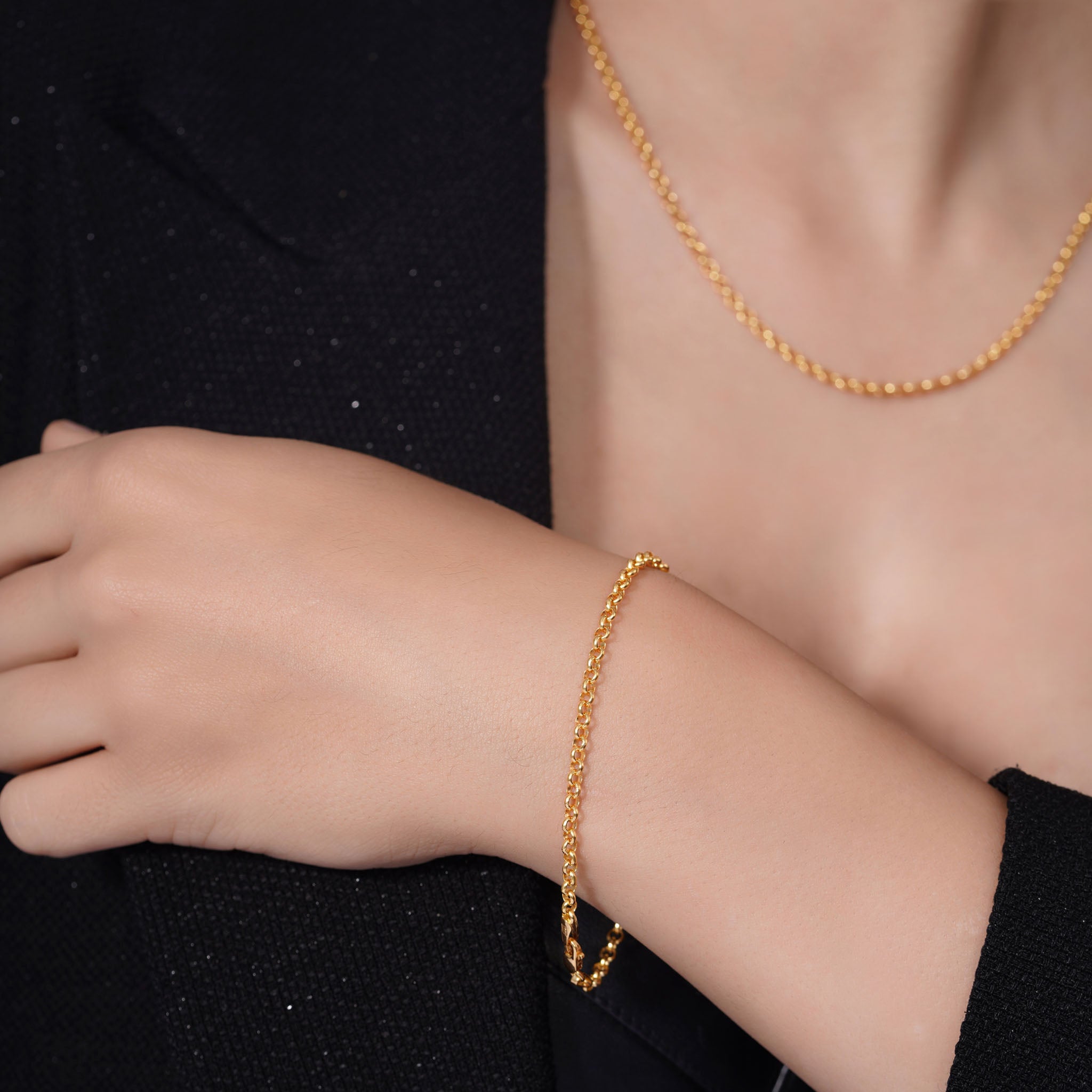 Vermeil Gold Rolo Bracelet worn on a model's wrist, showcasing its elegance and craftsmanship.