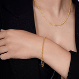 Vermeil Gold Rolo Bracelet worn on a woman's wrist, showcasing its elegant design and luxurious gold finish.
