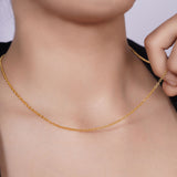Vermeil Gold Rolo Chain showcased on a model's neck, highlighting its elegant design and luxurious gold finish.