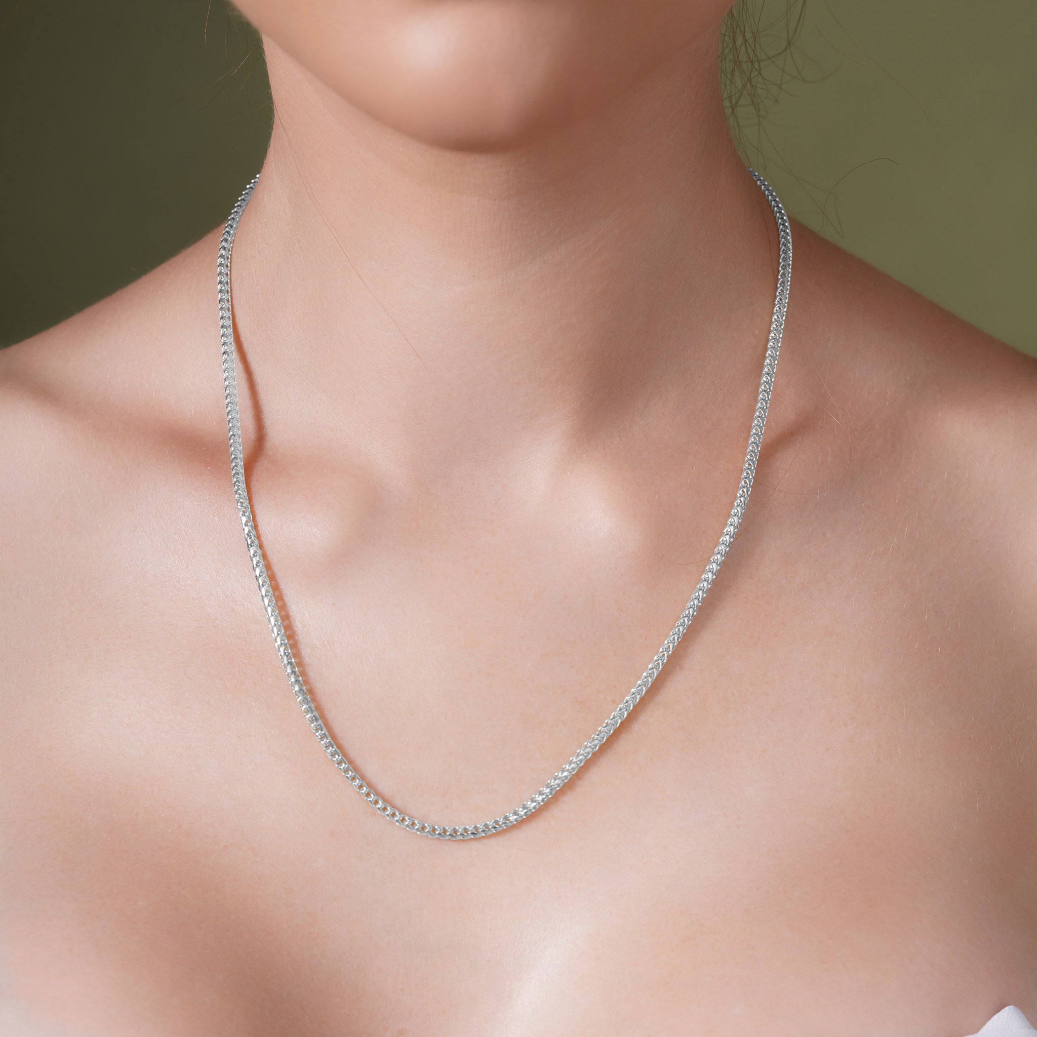 Diamond Cut Franco Silver Chain displayed on a woman, showcasing its exquisite sparkle and quality craftsmanship.