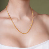 Diamond Cut Franco Vermeil Gold Chain worn on model's neck, showcasing its elegant design and sparkle.