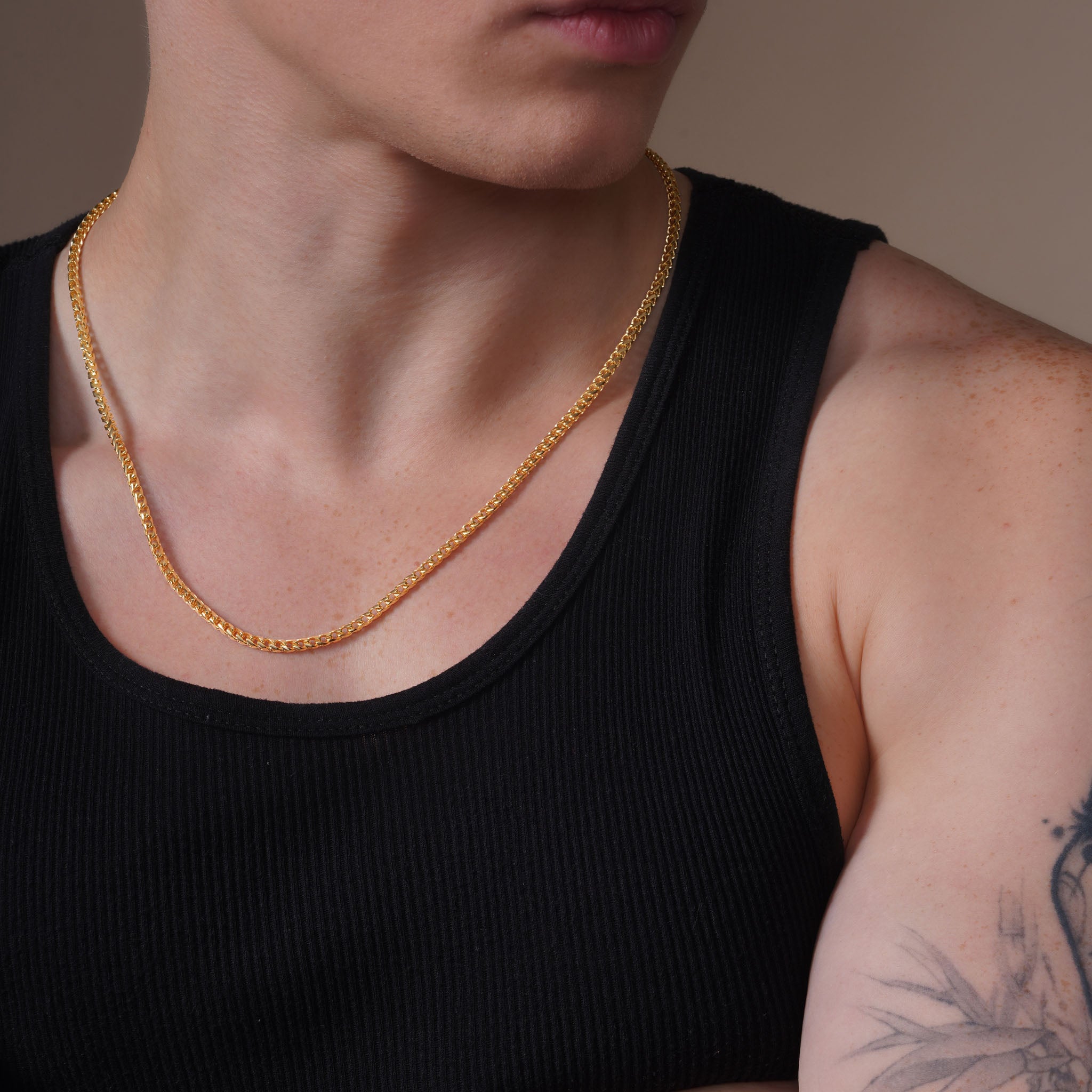 Men's Franco 18K Gold Vermeil Chain worn by a man in a black tank top, showcasing its luxurious design.