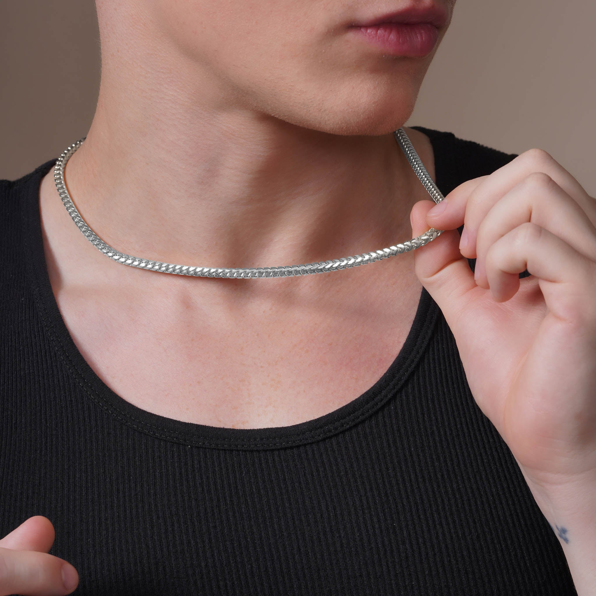 Men's Franco Silver Chain showcased on a model, highlighting its polished finish and robust design for everyday wear.