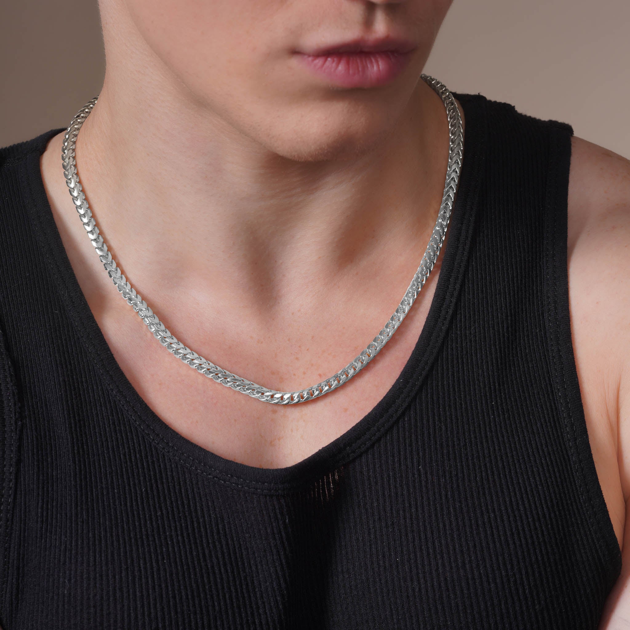 Men's Franco Silver Chain worn by a man, showcasing its polished finish and interlocking links.