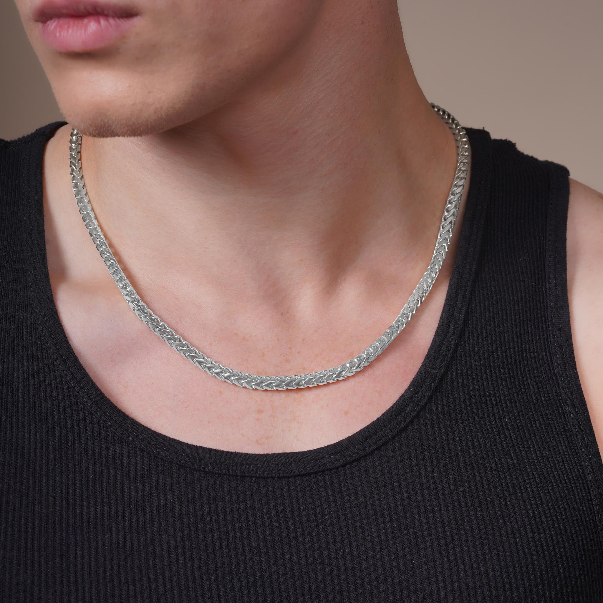 Men's Franco Silver Chain worn by a model, showcasing its elegant design and shiny finish.