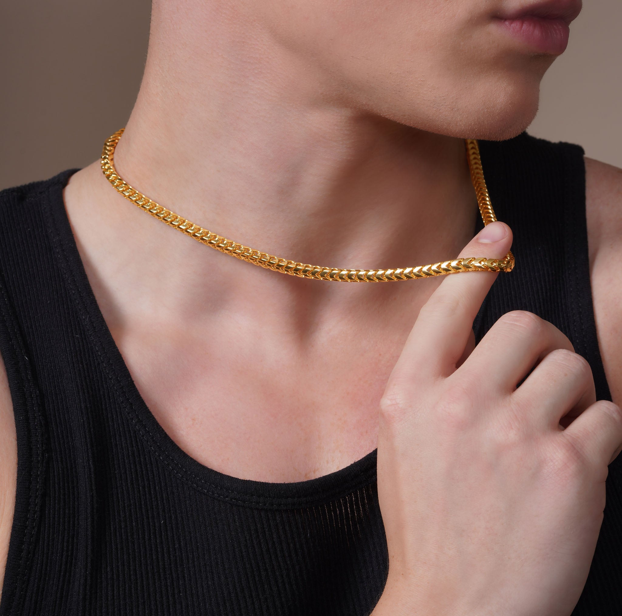 Close-up of a man modeling the Men's Franco 18K Gold Vermeil Chain, showcasing its stylish design and luxury feel.