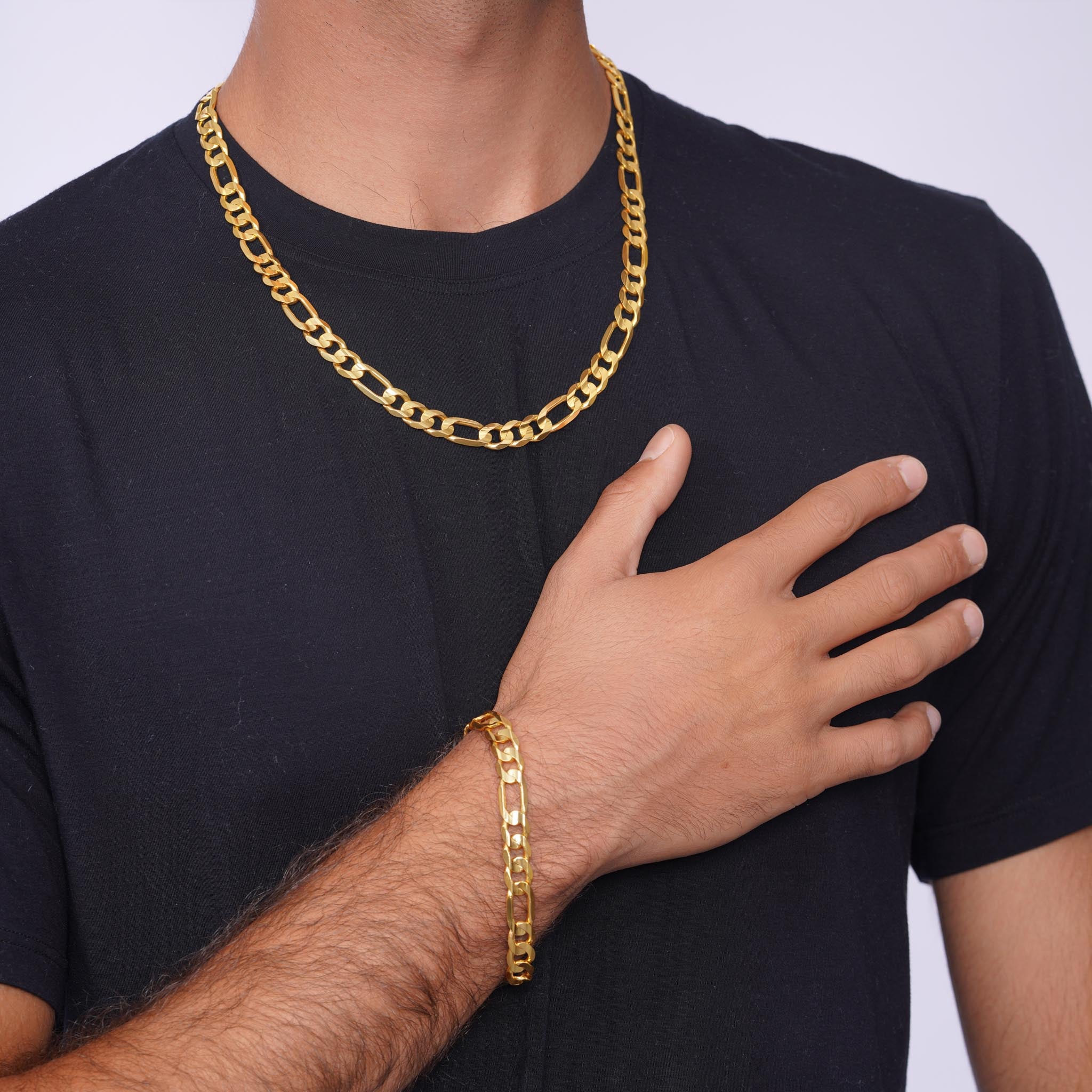 Men's Figaro Vermeil Gold Chain worn with a bracelet, showcasing elegant design and craftsmanship.