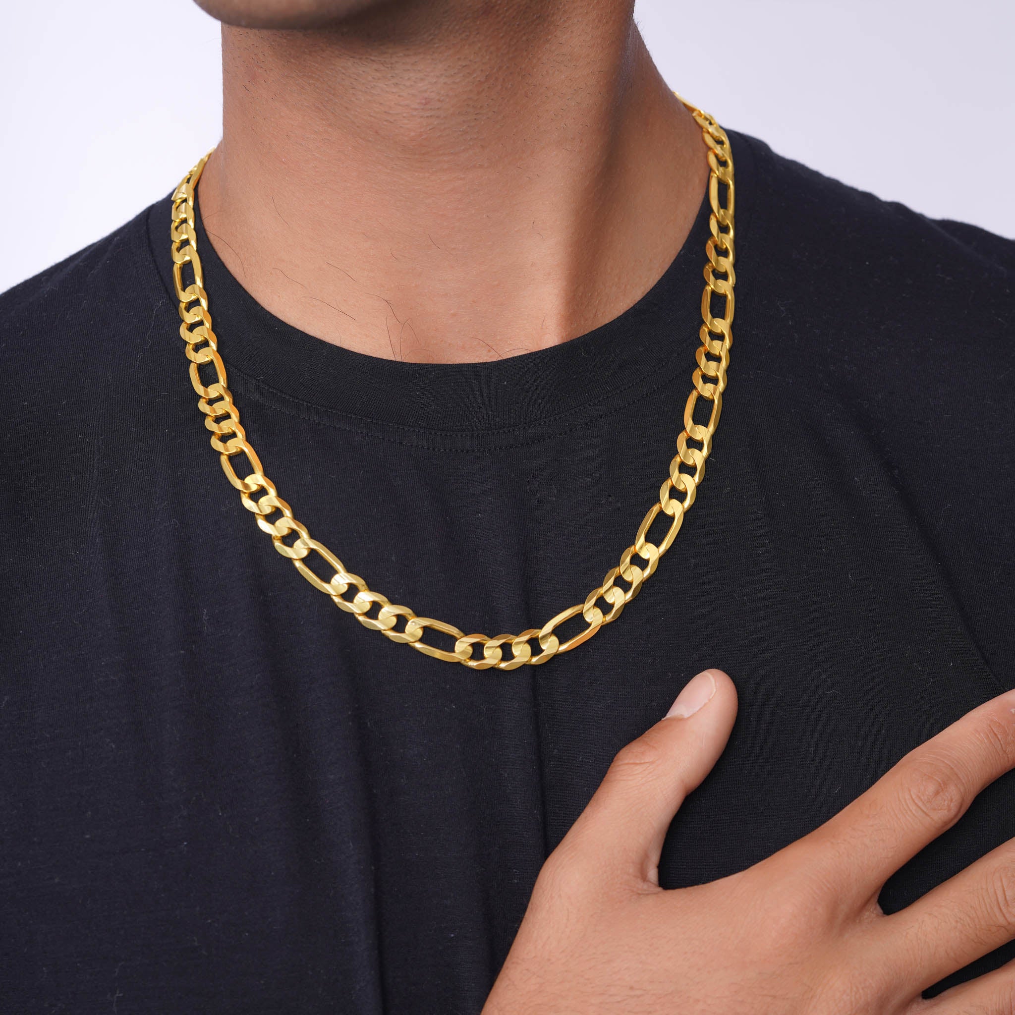 Men's Figaro Vermeil Gold Chain worn by a model with black shirt, showcasing elegance and style.