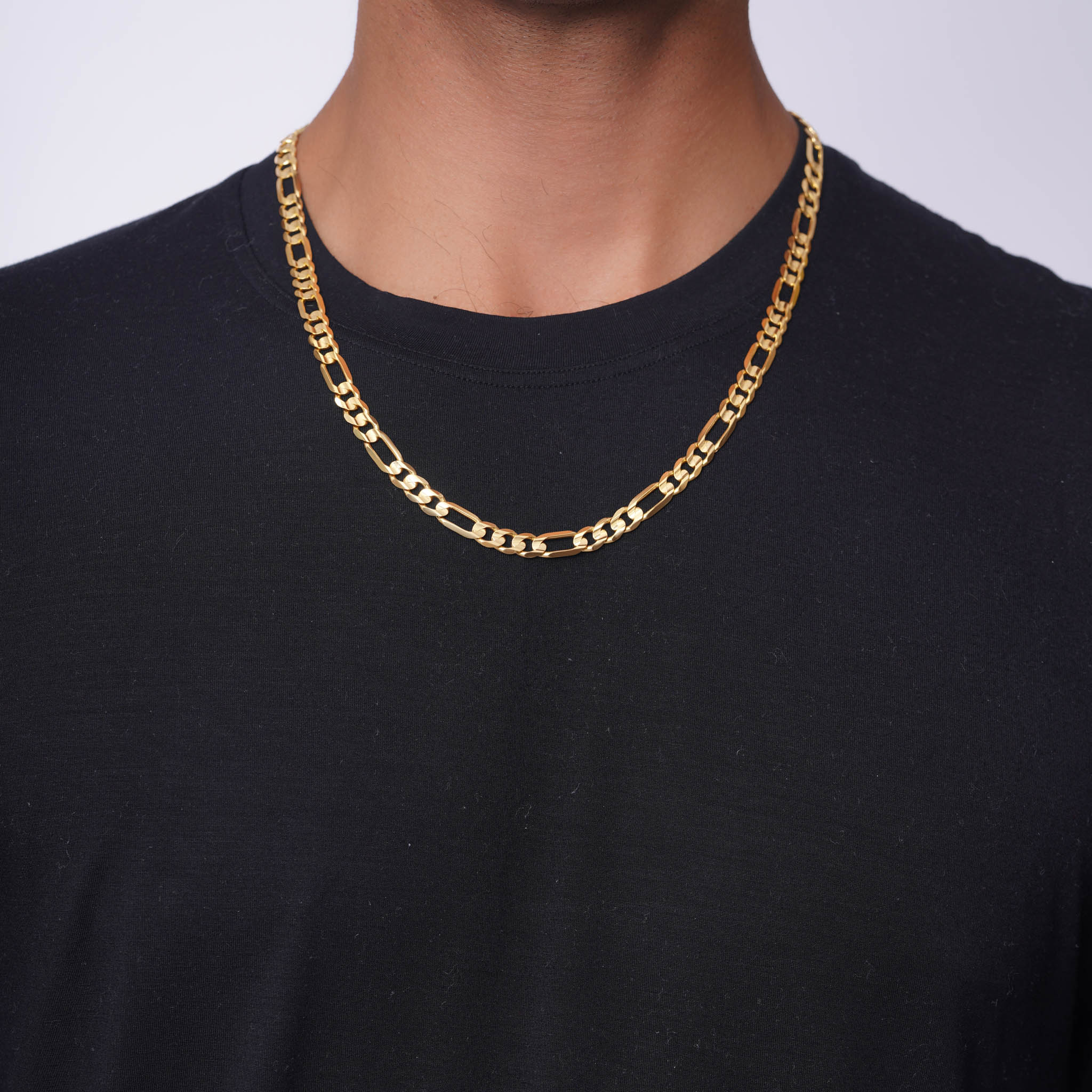 Men's Figaro Vermeil Gold Chain worn on a model's neck, showcasing its elegance and classic design.