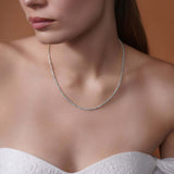 Model wearing a Sterling Silver Rope Chain Necklace, showcasing its shimmering texture and elegant design.
