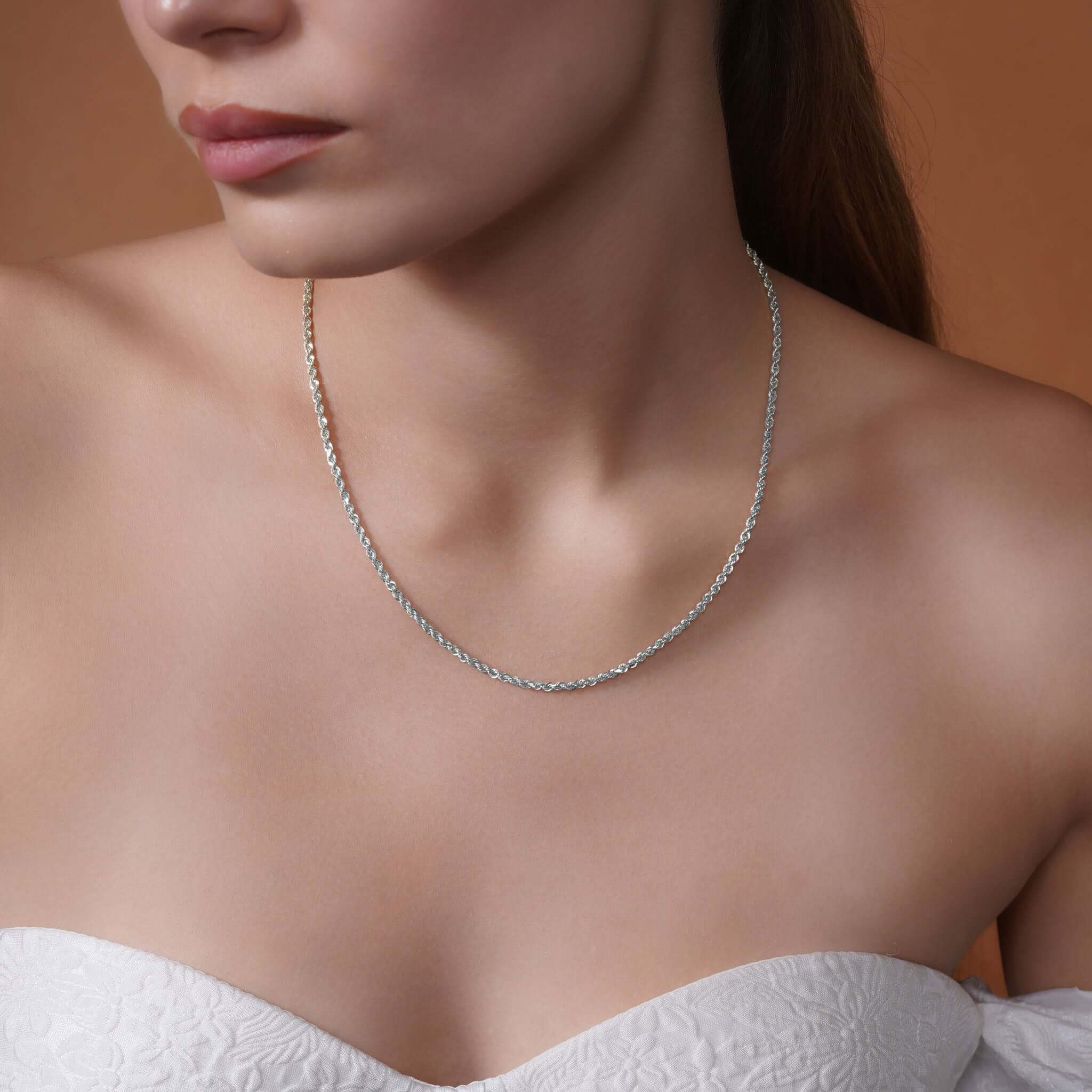 Model wearing a Sterling Silver Rope Chain Necklace, showcasing its shimmering texture and elegant design.