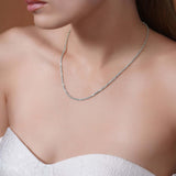 Sterling Silver Rope Chain Necklace worn by a model, showcasing its shine and texture against a bare neckline.