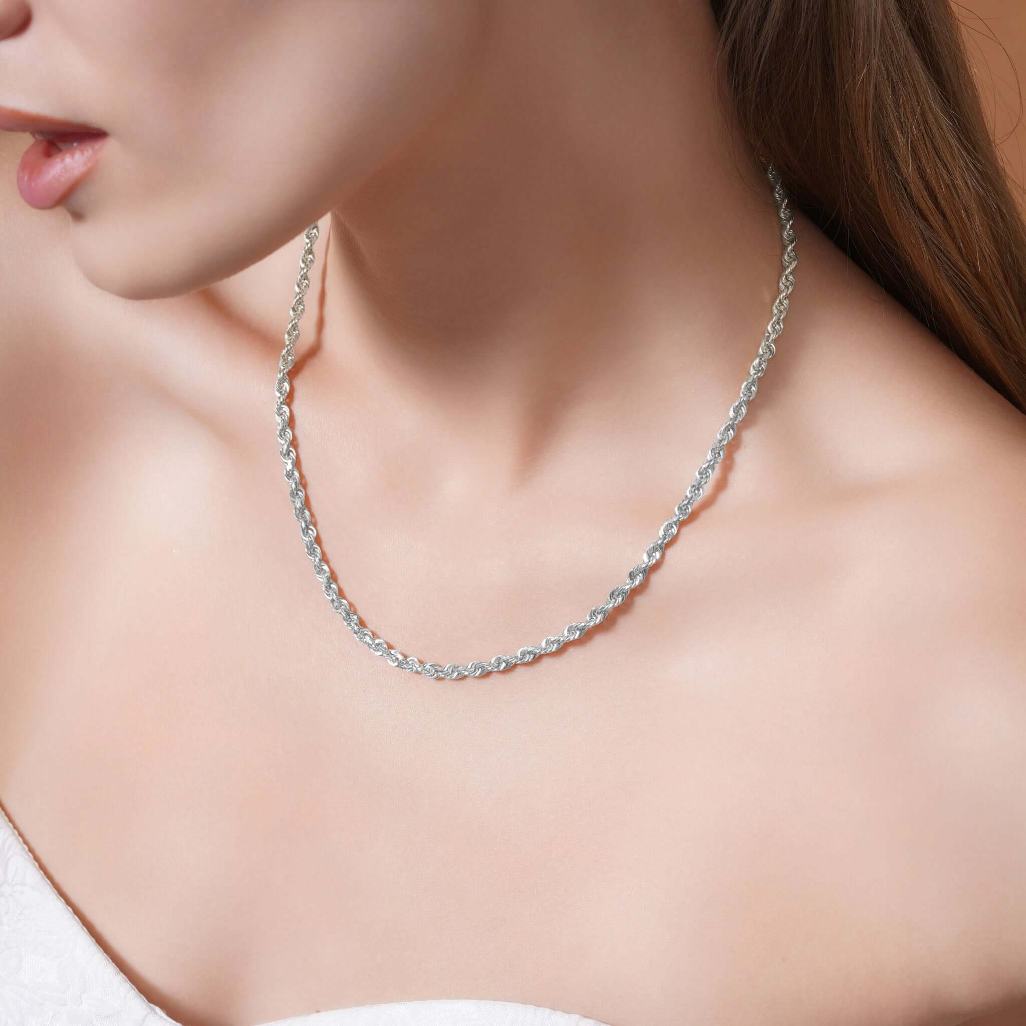 Sterling Silver Rope Chain Necklace worn by a model, showcasing its texture and shine.