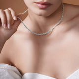 Sterling Silver Rope Chain Necklace worn by a model, showcasing its shine and texture against a soft background.
