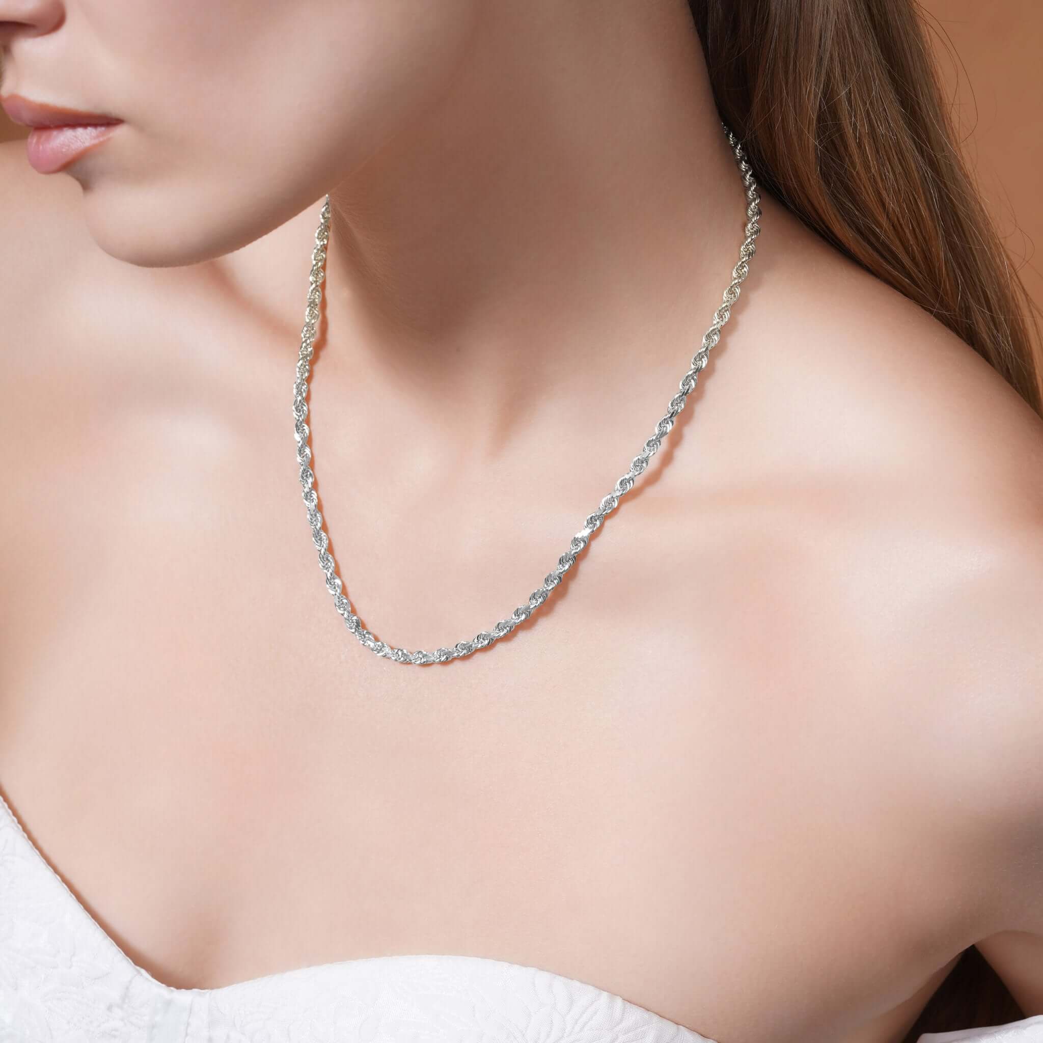 Model wearing a Sterling Silver Rope Chain Necklace, showcasing its shine and unique texture.