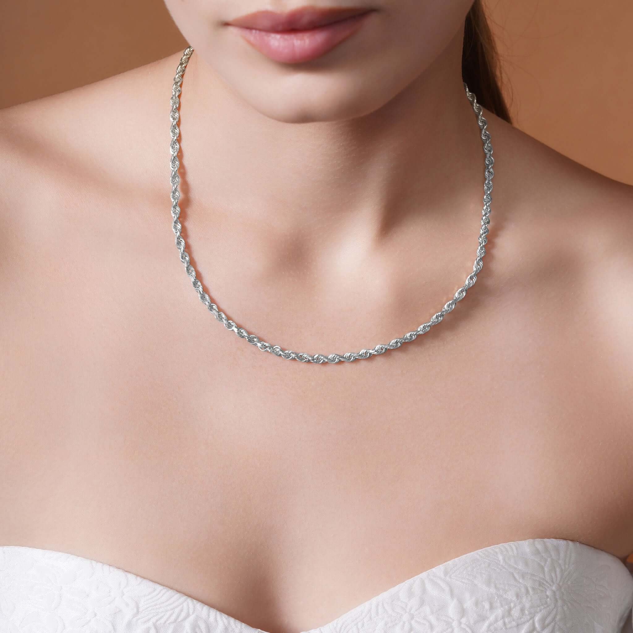 Sterling Silver Rope Chain Necklace worn by a model, showcasing its texture and shine.