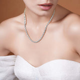 Sterling Silver Rope Chain Necklace worn elegantly, showcasing its texture and shine against a model's skin.