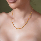 18K Gold Vermeil Franco Chain showcased on model, highlighting luxury and craftsmanship.