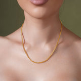 Elegant 18K Gold Vermeil Franco Chain worn by a model, showcasing its luxurious design and craftsmanship.
