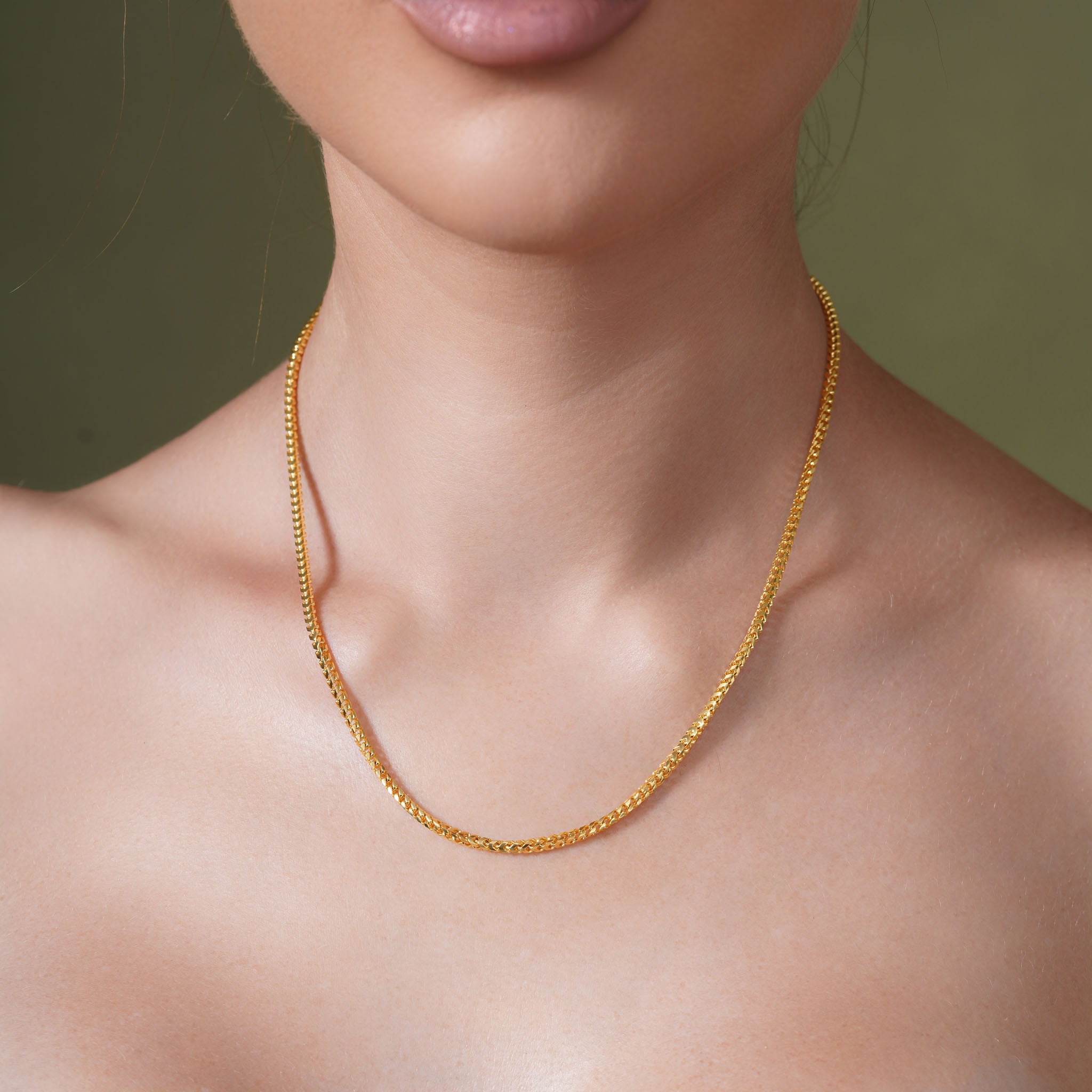 Elegant 18K Gold Vermeil Franco Chain worn by a model, showcasing its luxurious design and craftsmanship.