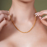 Model wearing an 18K Gold Vermeil Franco Chain showcasing its elegance and craftsmanship.