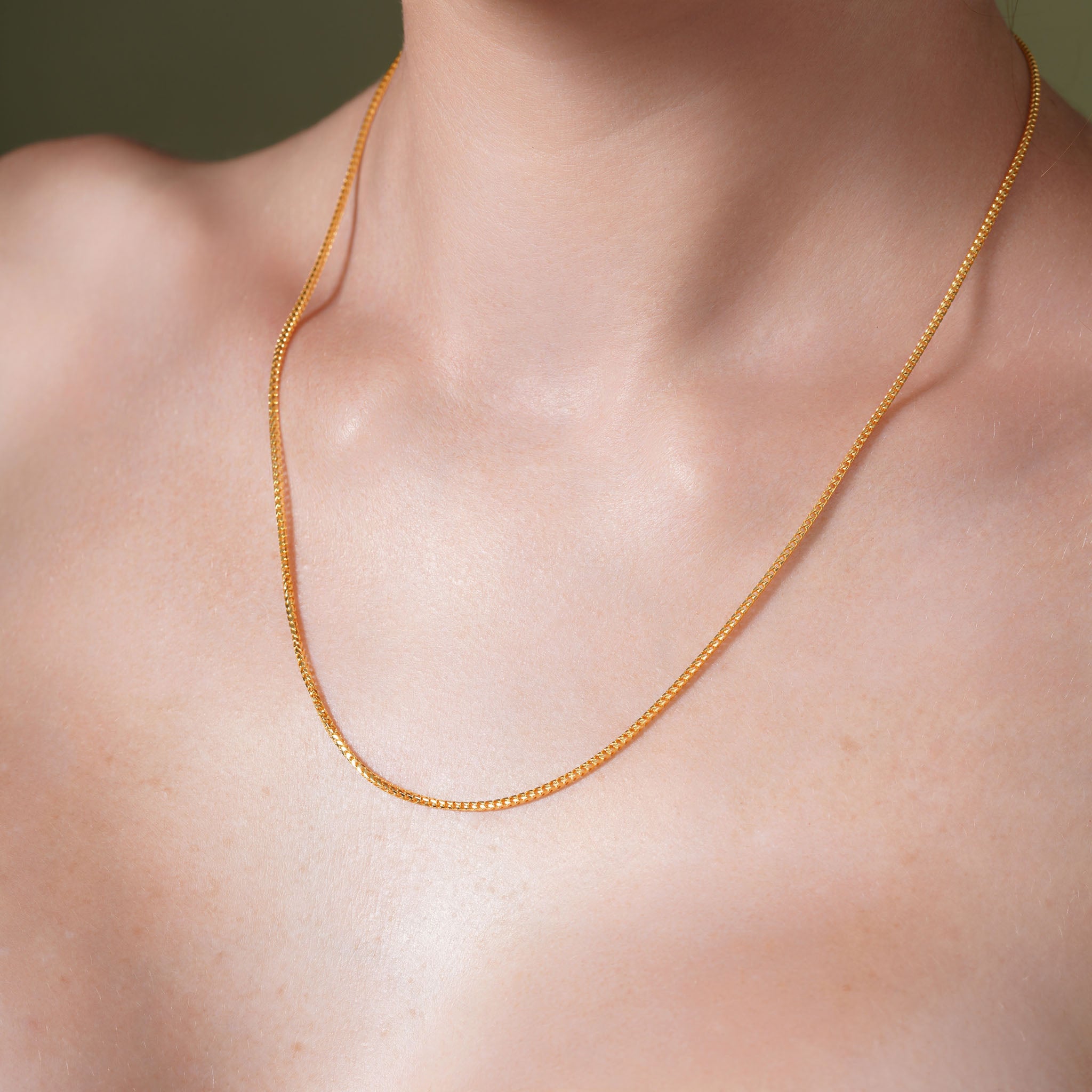 18K Gold Vermeil Franco Chain worn elegantly, showcasing its luxurious design and craftsmanship.