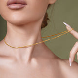 18K Gold Vermeil Franco Chain showcased on model's neck highlighting its elegance and craftsmanship.