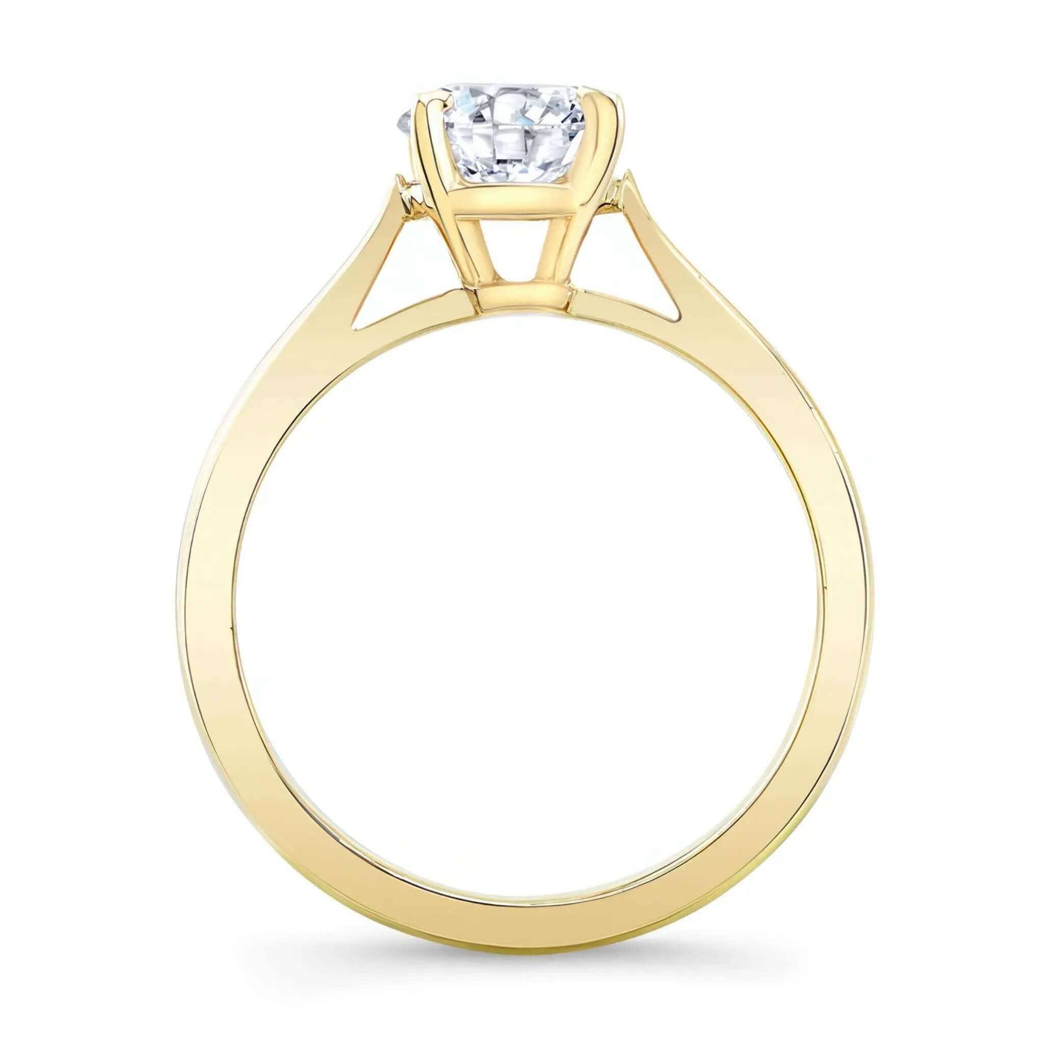 Round Moissanite Solitaire Engagement Ring with a delicate yellow gold band and a stunning center stone.