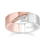 Men's unique diamond wedding band with channel set round diamond and mixed metal design.