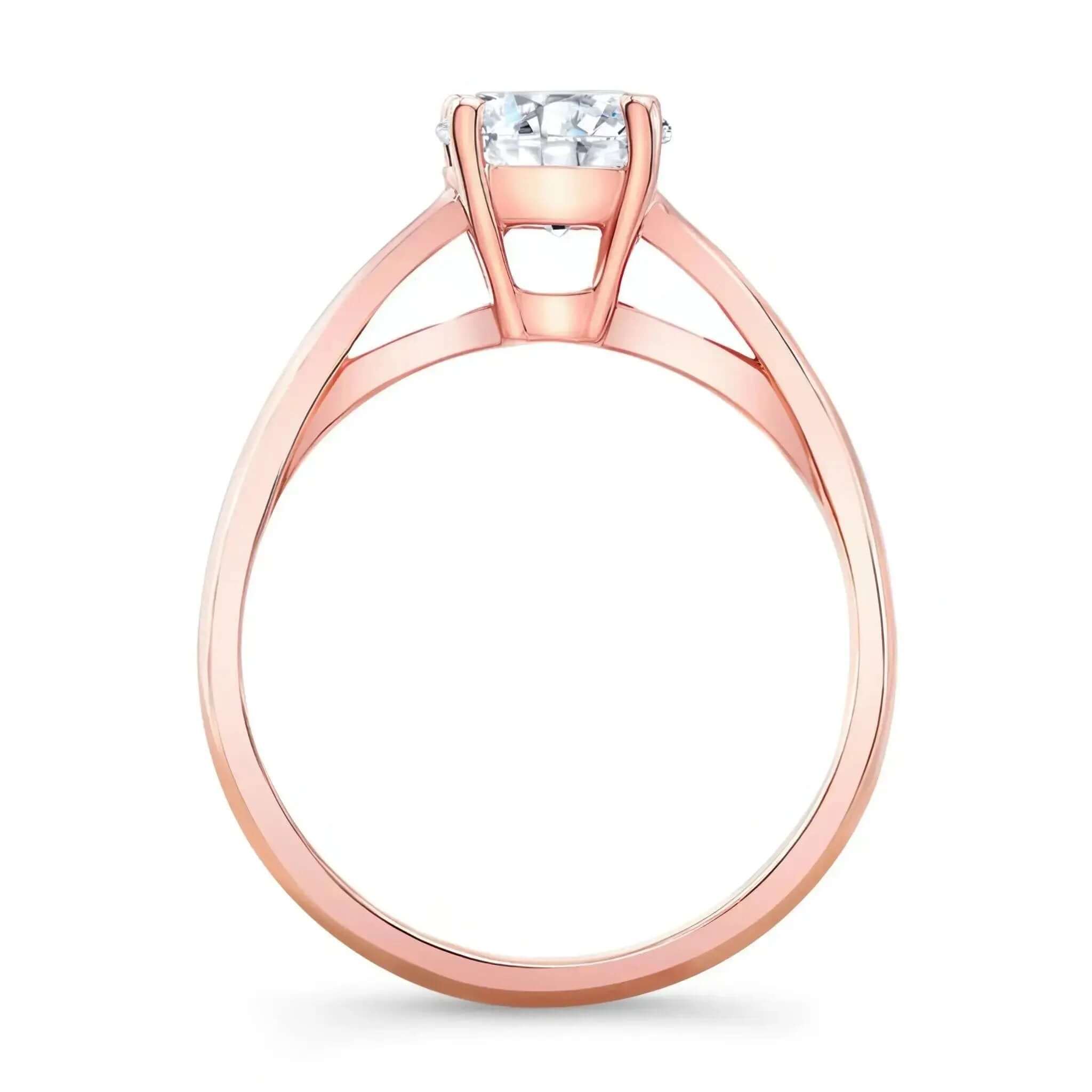 Round Moissanite Solitaire Ring with a unique shoulder design supporting the brilliant center stone.