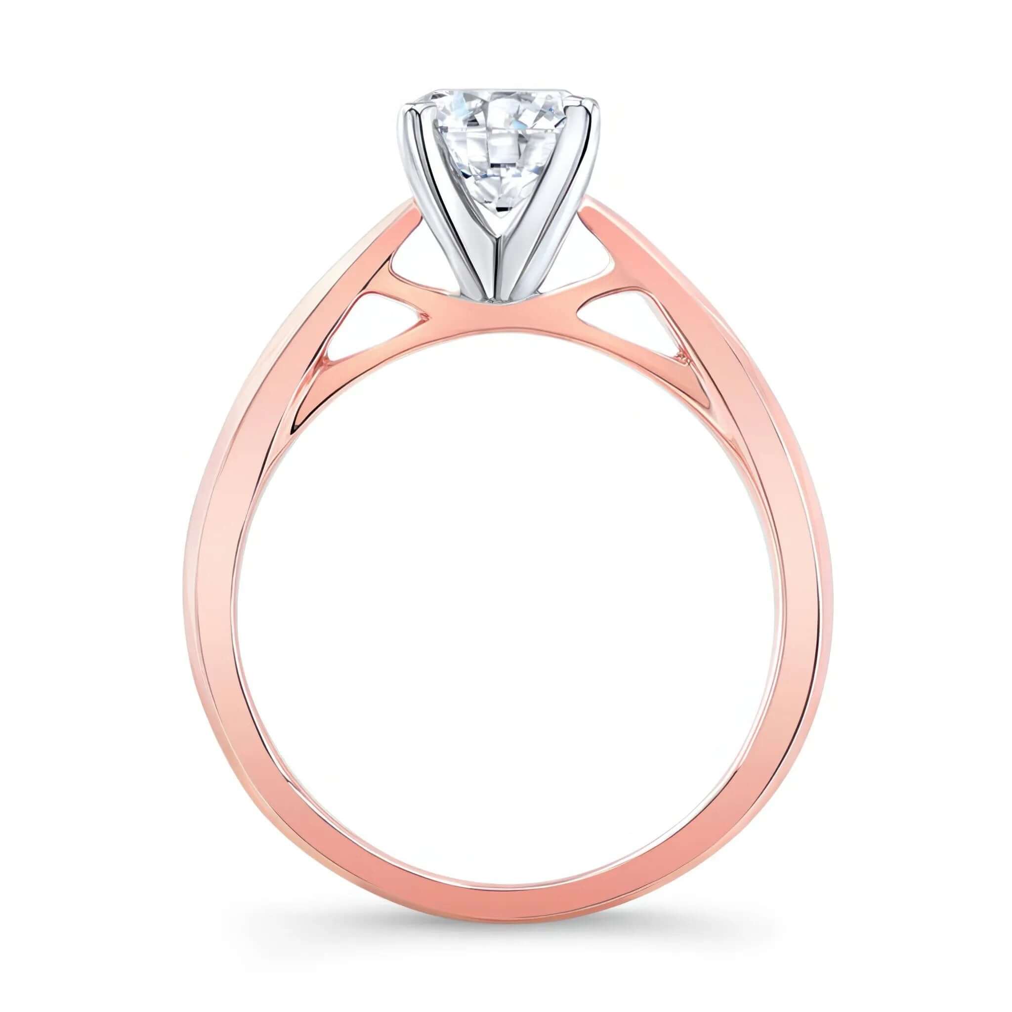 Tapered Solitaire Ring featuring a curved shank and a brilliant round center diamond.