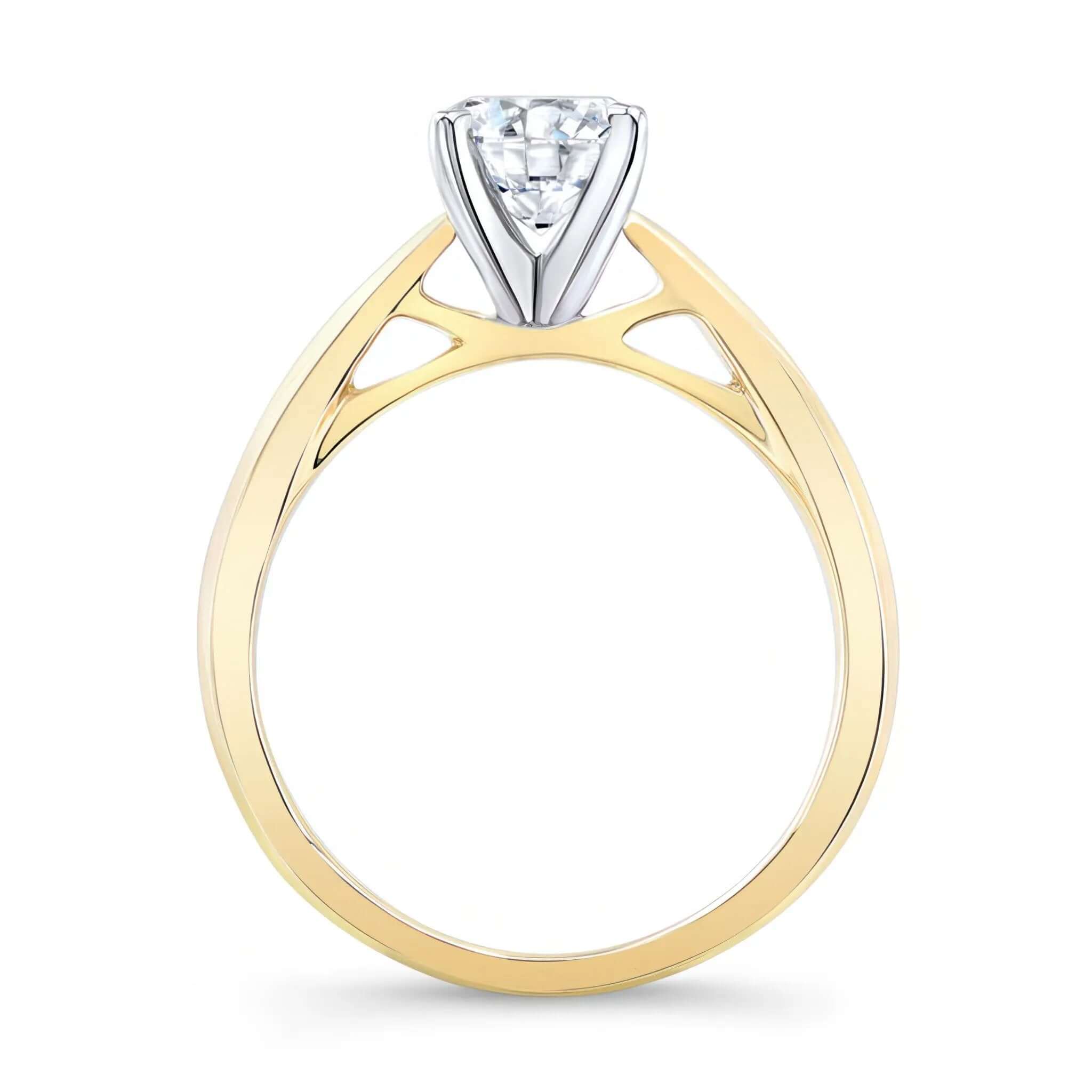 Tapered Solitaire Ring with a brilliant round center and a delicately curved shank, showcasing elegance.