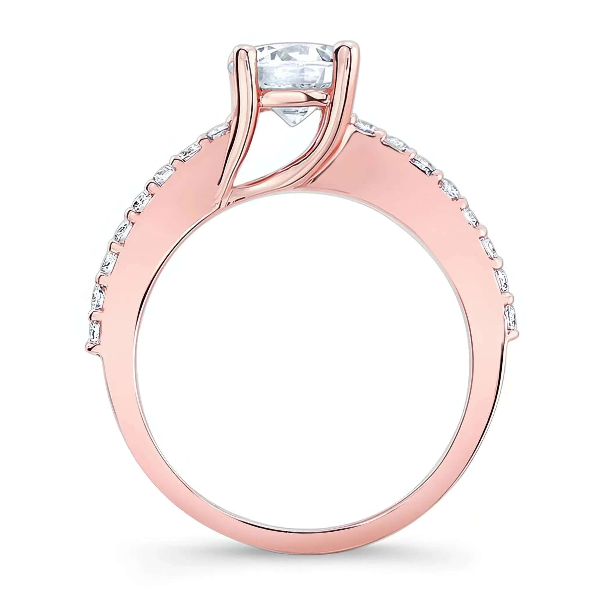 4 Prong Engagement Ring featuring a round center with diamonds along the shoulders in rose gold.