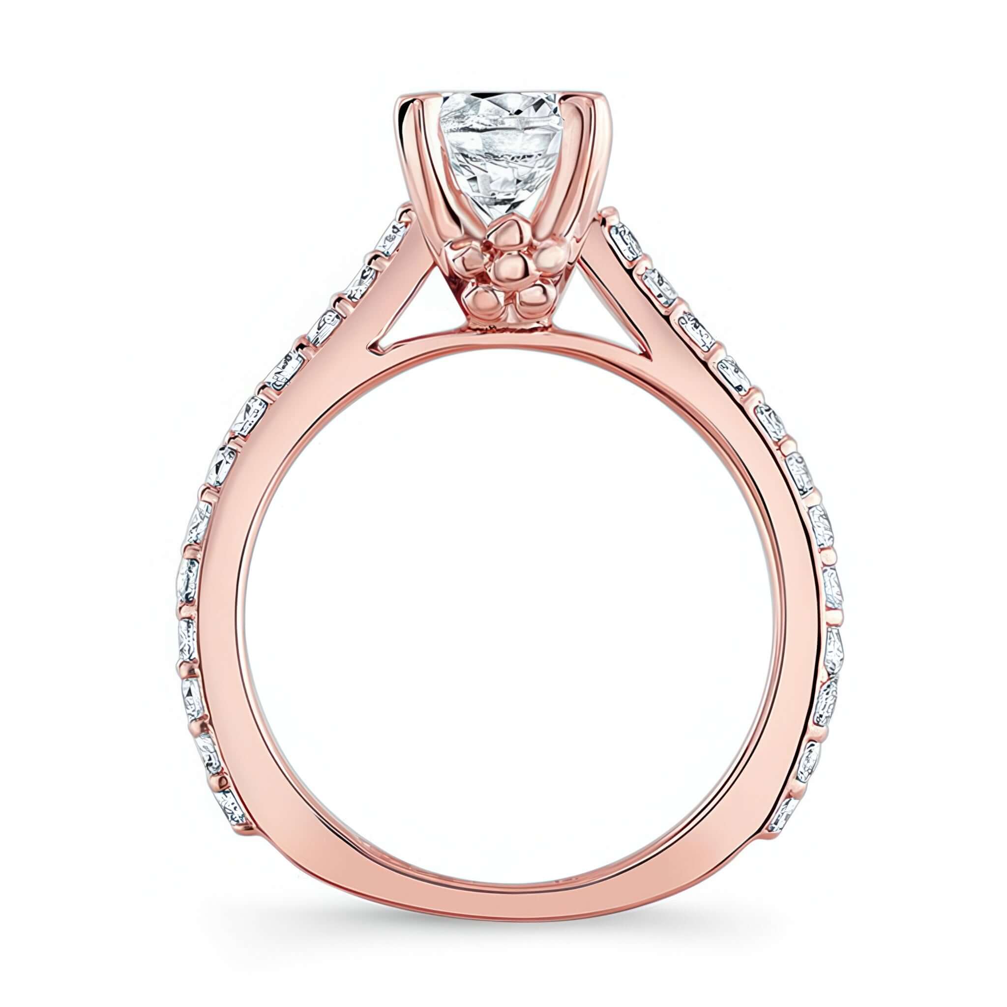 Simple Flower Ring featuring a prong set diamond center with flower accents on the shoulders and diamond details.