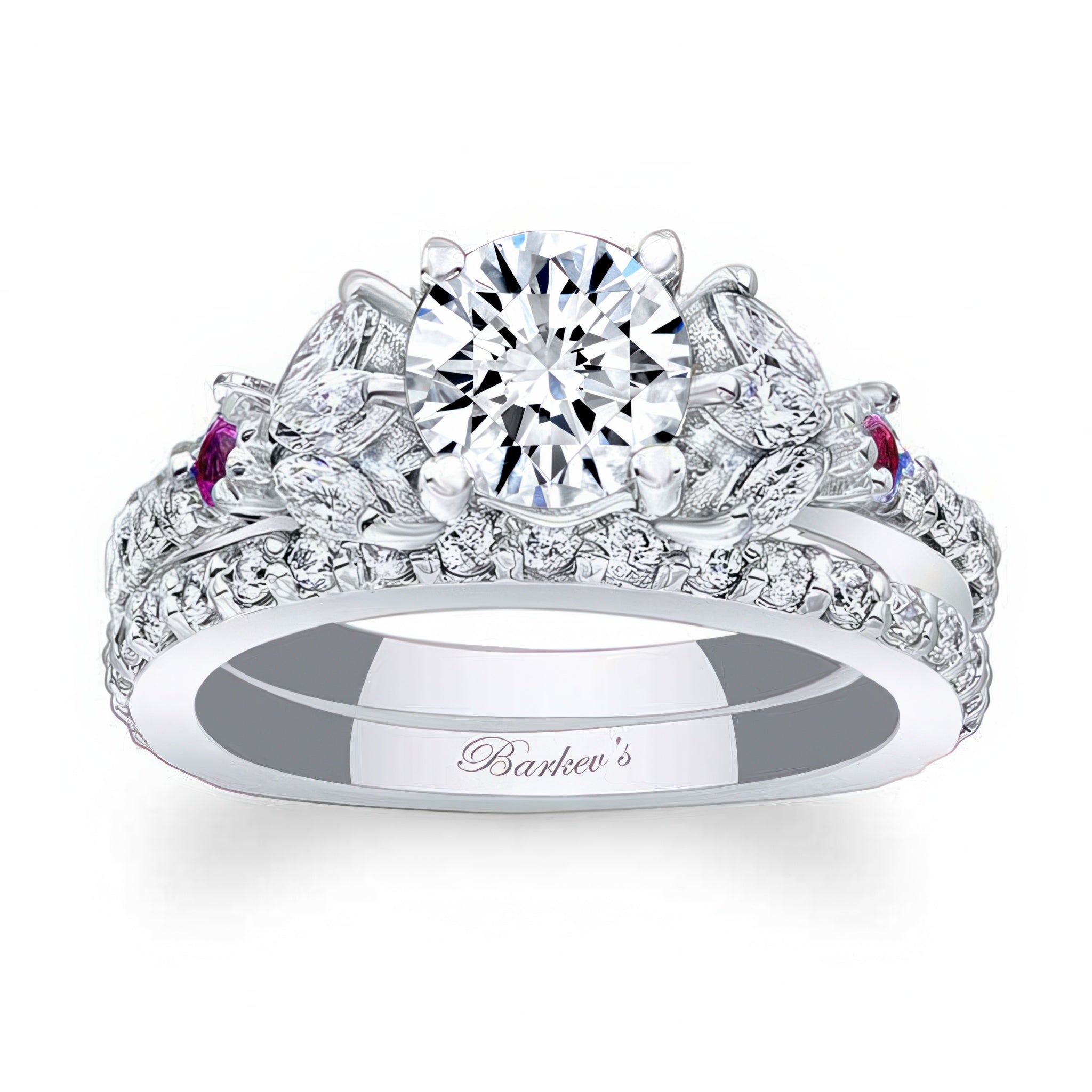 A white gold ring with a round central diamond, marquise and round pink sapphire accents, and a matching wedding band.
