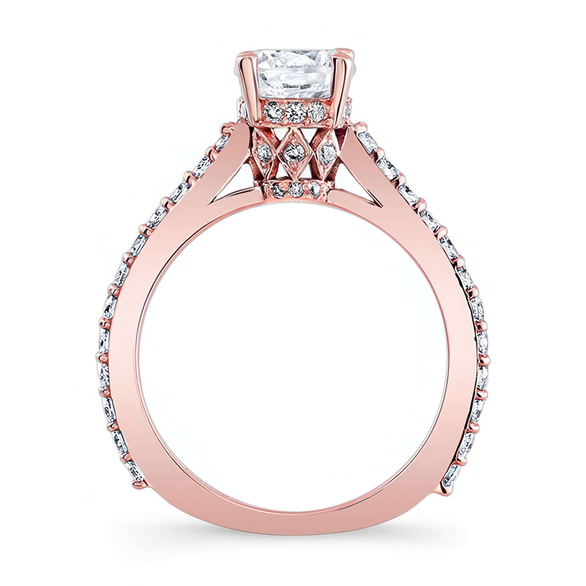Traditional Diamond Ring featuring a prong set round center and shared prong set diamonds on the shoulders.