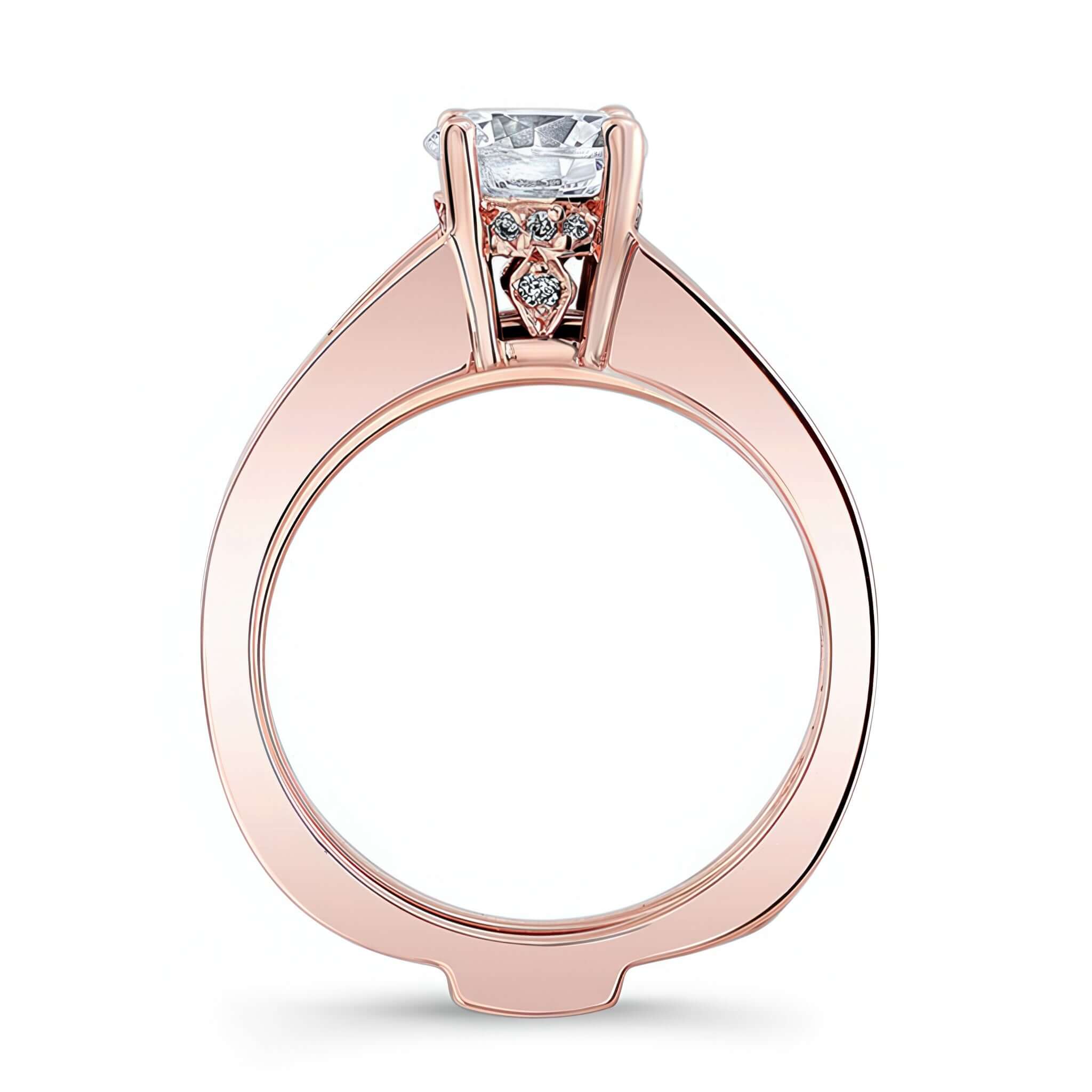 Interlock Bridal Set featuring a prong set round center stone and diamond accents in rose gold.
